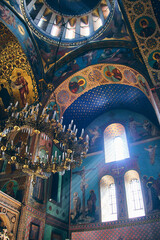 Low angle view of The Sioni Cathedral of the Dormition interior. Frescos and chandelier in Georgian Orthodox cathedral in Tbilisi, Georgia