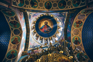 Fototapeta na wymiar Bottom up view of The Sioni Cathedral of the Dormition ceiling. Frescos and chandelier in Georgian Orthodox cathedral in Tbilisi, Georgia