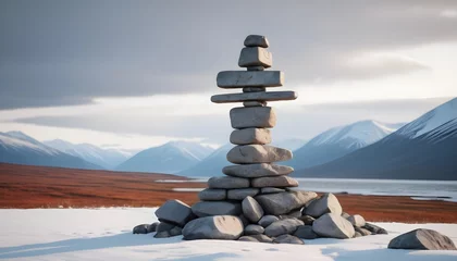 Tuinposter A minimalist Inukshuk made of piled stones pointing the way across the Alaskan tundra © Zulfi_Art