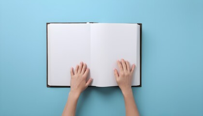 Woman with open photo album at light blue background, top view. Space for text - obrazy, fototapety, plakaty