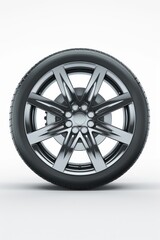 Obraz premium A car wheel isolated on a white background. Suitable for automotive concepts