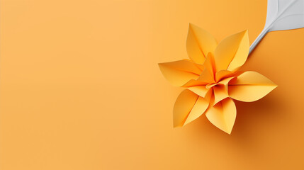 Origami flower on yellow background, leaf decoration design