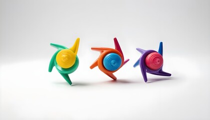 Three colorful spinning tops on white background