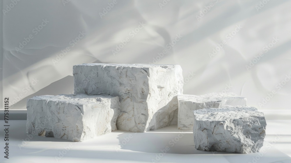 Poster a group of white rocks on top of a white floor. suitable for various design projects