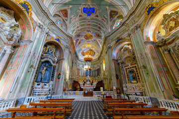 Fototapeta na wymiar Ornate interior of the 17th century Church of San Giovanni Battista in the hilltop town of Cervo, Italy, along the Mediterranean coast of the Imperia, Liguria region.