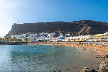 Fototapeta premium Seen from the beach of the touristic coastal town Mogan in the south of Gran Canaria. Spain