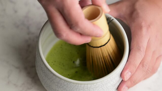 close up shot of whisking matcha 