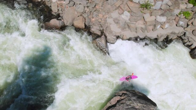 Whitewater Kayaking Over a Waterfall Drone Top View