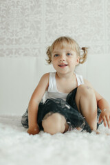 Little Girl Sitting on Floor