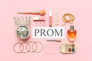 Word PROM with disco ball, female accessories and makeup products on pink background