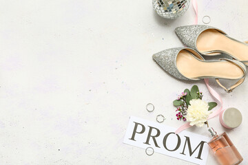Word PROM with female shoes, boutonniere and perfume bottle on lilac grunge background