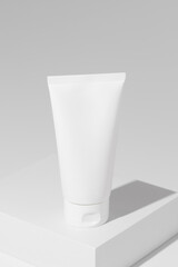 Empty white plastic tubes for cosmetics. Mockup. Packaging for cream, gel, serum, advertising and product promotion