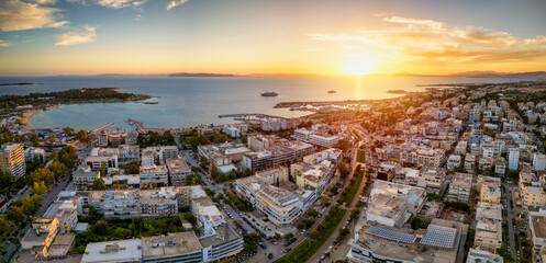 Aerial view of the popuar shopping district of Glyfada, South Athens Riviera, Greece, during a golden sunset - 775338558