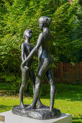 Life-size metal sculpture in a chateau garden