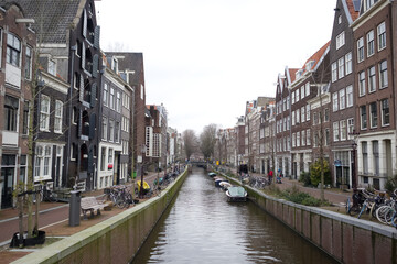 View of the river canal and brick houses in Amsterdam 10.02.2024
