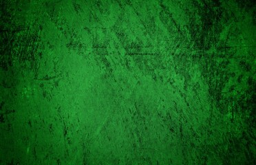 Fototapeta premium A textured green grunge background with dark patches and rough surface