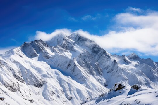 snow-capped mountain range panoramic landscape photograph, shot with a DSLR camera and a wide-angle lens, conveying the vastness and majesty of mountain