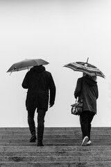 people under umbrella Couple under an umbrella 