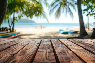 Fototapeta premium Wooden table top on blurred beach background with surfboards