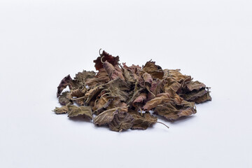 Dried patchouli leaf oil ingredient on isolated white background