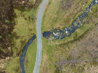 footpath and river in wicklow mountains, ireland