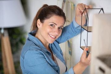 Foto auf Acrylglas young woman hanging deco on the wall © auremar