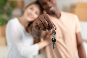 happy young couple welcome in their new house