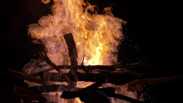 Beautiful Close up of a bonfire being ignited with raw Cachaça
