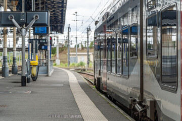 A train stationed on the platform at Dax railway station in France, capturing the essence of travel and anticipation