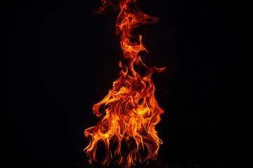 Texture of fire on a black background. Abstract fire flame background, large burning fire.