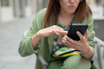 Modern woman using smartphone in urban setting