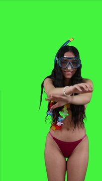 vertical Latin girl in bikini with snorkel gear simulating diving Green Screen Chroma Key