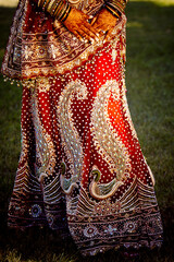 Red and gold sari skirt on bride