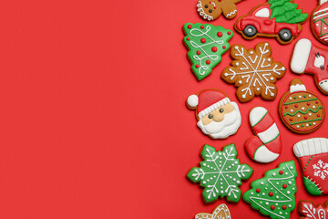 Fototapeta na wymiar Different tasty Christmas cookies on red background, flat lay. Space for text