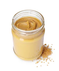 Poster Glass jar of tasty mustard sauce and dry seeds isolated on white © New Africa
