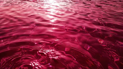 Fotobehang smooth red  bordeaux water with gentle ripples and a single point of sparkling light © Klay