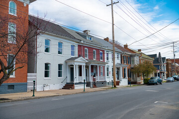 street in the historic town of Martinsburg, West Virginia. Ancient architecture of small multi-colored buildings in the colonial style.