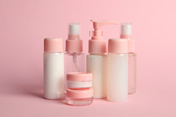 Cosmetic travel on pink background. Bath accessories
