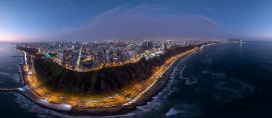 Wandcirkels tuinposter Panoramic aerial view captured with a drone, of the Miraflores district, in Lima, Peru.  The cliffs, the "Costa Verde" highway, the Miraflores boardwalk and the Pacific Ocean with the sky at sunset. © christian vinces