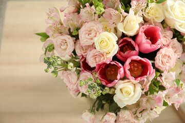 Beautiful bouquet of fresh flowers on table indoors, closeup