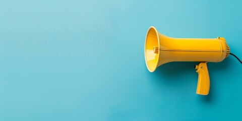 A yellow microphone is on a blue background. The microphone is the main focus of the image, and it conveys a sense of excitement and energy - obrazy, fototapety, plakaty