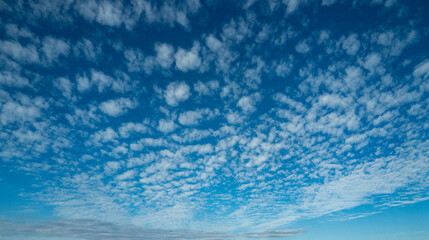 Cloud on blue sky with copy space. Pastel soft fluffy clouds with empty space for banner. Paradise dreamy concept. Real sky background with clouds. Poster with Clouds.
