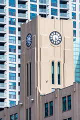 Fototapeta premium The clock tower of the Queen's Quay Terminal, a heritage building in Toronto, Canada