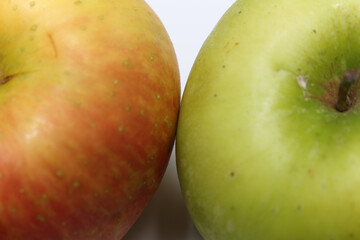 red and green apples. closeup on pieces of red and green apples. fruit details. apple with selective focus.