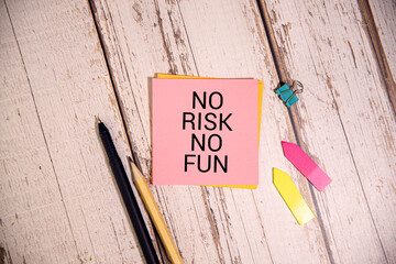 top with stylized handwriting with the text: no risk no fun