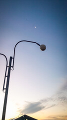 Super full moon against a clear blue sky in the morning. Horizontal photography.