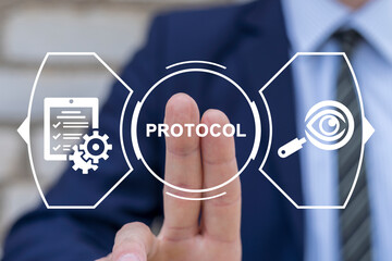 Businessman using virtual touchscreen presses text: PROTOCOL. Protocol busines concept. Protocols Procedures Rules Regulation Compliance Technology.