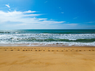 Summer sea waves crashing on sandy shore seascape background,Wide angle lens ocean nature background