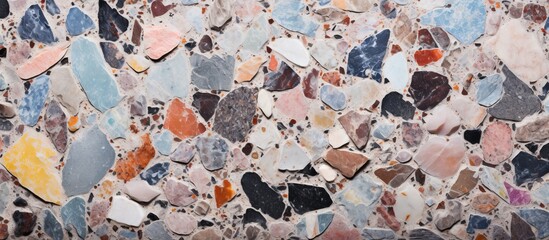 A detailed view of a sturdy wall composed of a diverse range of differently colored and shaped rocks - obrazy, fototapety, plakaty