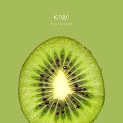 Creative layout made of kiwi on the green background. Food concept. Macro concept.